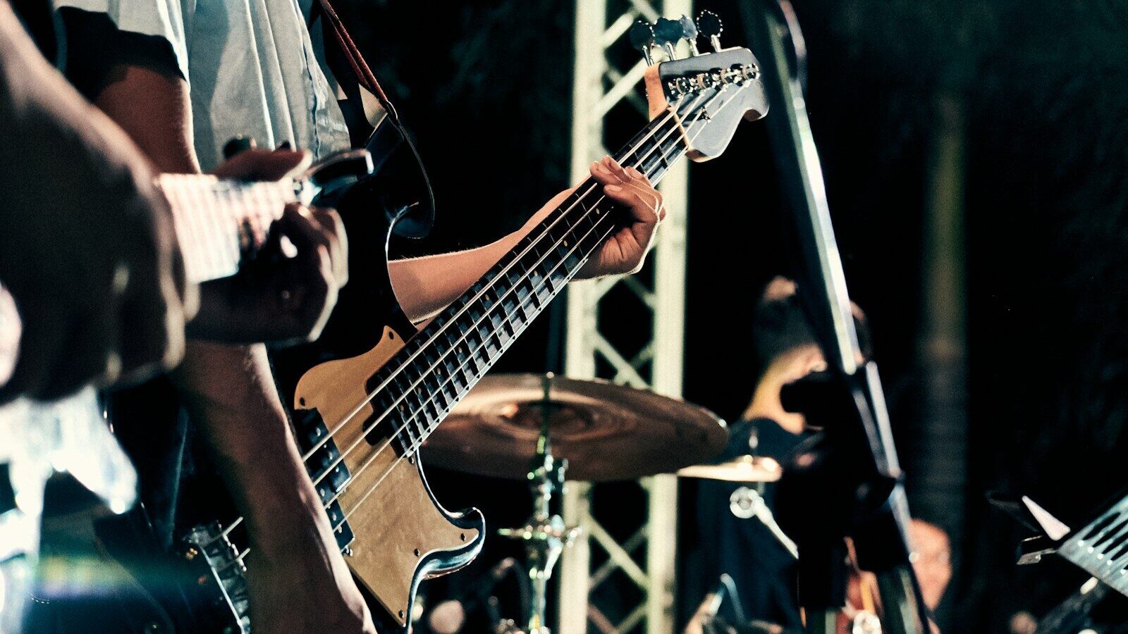 man playing guitar on stage